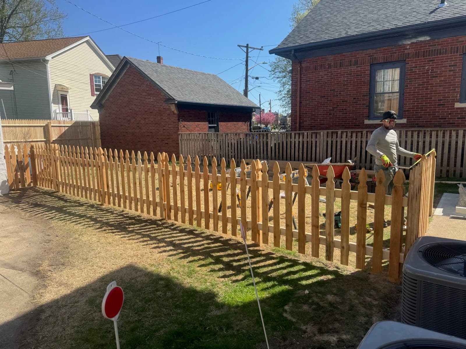 Charming Wooden Picket Fence Installation image